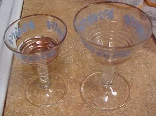 & wine glasses w/blue flowers and gold rings & rim. unknown maker